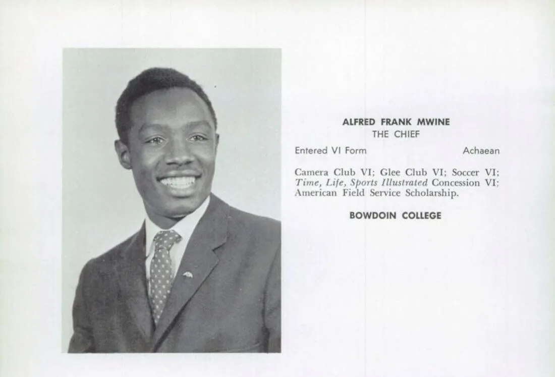 Black-and-white yearbook senior page: a smiling young Black man in a tweed jacket and polka-dot tie, beside text reading "Alfred Frank Mwine, The Chief" with his school activities and the words "Bowdoin College."